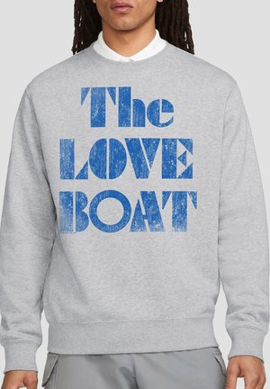 Gray sweatshirt with blue distressed text reading "The LOVE BOAT." Features a ribbed crewneck and cuffed sleeves. Soft fabric texture.