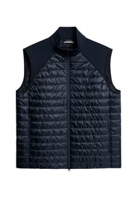 Marinblå quiltad väst med hög krage, dragkedja fram och sidofickor. Har ett mjukt, stretchigt tyg på axlarna och halsen.