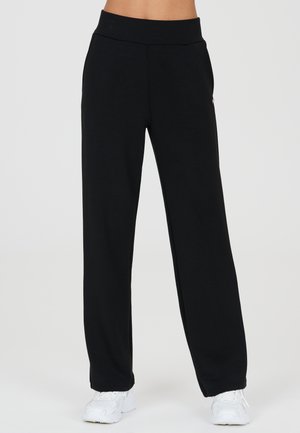 Athlecia JACEY - Jogginghose - black