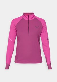 Πουλόβερ fleece σε δύο τόνους ροζ, με μισό φερμουάρ στον γιακά, μακριά μανίκια και υφασμάτινη υφή με λογότυπο στο στήθος.