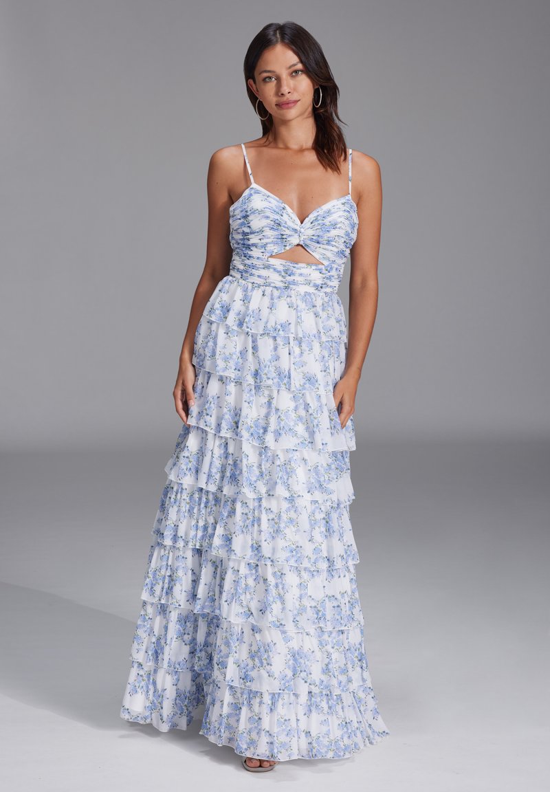Long floral dress dengan ruffles berlapis, menampilkan pola biru dan putih, bodice yang pas dengan detail twist, dan tali tipis yang bisa disesuaikan.