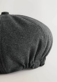 Gray felt cap with a round, gathered design. Notable features include a top button and pleated texture along the sides.