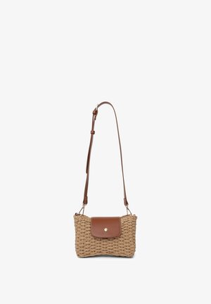 Woven straw crossbody bag in beige with a brown leather flap and button closure. Adjustable strap with gold hardware accents.