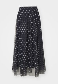 Marinblå polka dot nederdel med elastisk talje, lavet af et gennemsigtigt stof med lagdelt design, der har hvide cirkulære mønstre overalt.