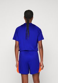 adidas Performance TIRO 24 JUMPSUIT - Overal - lucid blue/app solar red