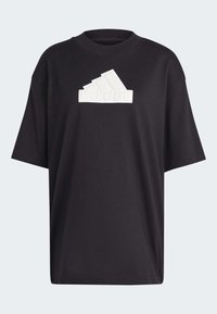 Camiseta de algodón negra con mangas cortas, que presenta un gráfico de logo blanco en el frente. Cuello redondo, corte relajado, textura suave.