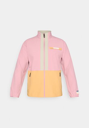Men’s zip-up jacket with pink upper, beige collar and zipper area, and yellow lower section, featuring zippered pockets and a small chest emblem.