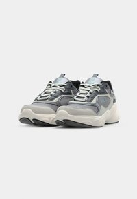 Gray and mint sneakers with a mix of leather and suede. Thick white midsole, textured black outsole, prominent branding, and lace closures.