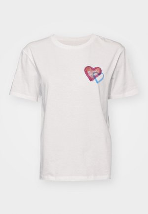 White cotton t-shirt featuring a small, multicolored heart design on the left chest area, with red and blue stripes and text.