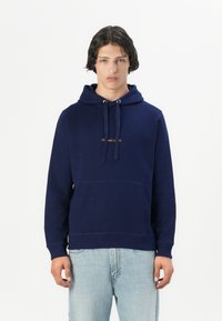 Navy blue hooded sweatshirt made of cotton, featuring a front pocket and drawstrings, with small text logo in gold above the pocket.