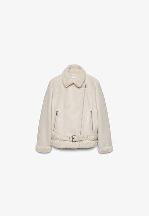 Giacca in shearling beige chiaro con collo in pelliccia, zip frontale asimmetrica, due tasche con zip e vita con cintura.
