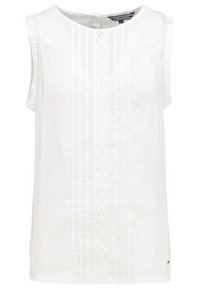 Blouse blanche sans manches avec col rond, dentelle verticale et plis devant, finition en dentelle aux emmanchures.