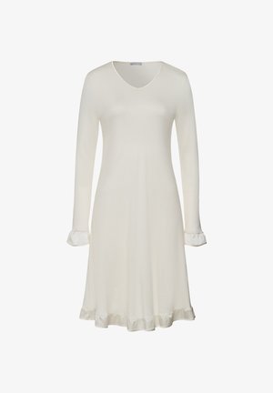 Long-sleeved cream dress with a V-neck, ruffled cuffs, and a ruffled hem. Made from soft material with a smooth texture.