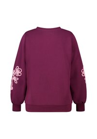 Bordeauxrode trui met een ronde hals en lange mouwen. Heeft roze bloemrijke borduursels op de mouwen. Glad stof met geribde manchetten.