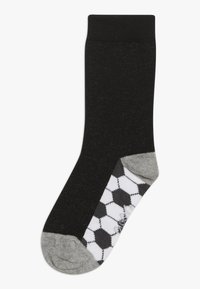 Șosetă din bumbac neagră cu un vârf texturat; călcâi și vârf gri, prezentând un model hexagonal de minge de fotbal alb-negru pe partea inferioară.