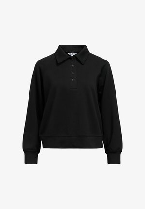 Melna džemperis ar apkakli, piecu pogu aizdari un raglāna piedurknēm. Izgatavots no mīksta auduma ar brīvu piegriezumu un ribotām piedurknēm.