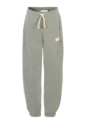 Pantalons de survêtement gris clair en tissu doux, avec une taille élastique, un cordon de serrage et des poignets côtelés. Un petit logo imprimé en beige.