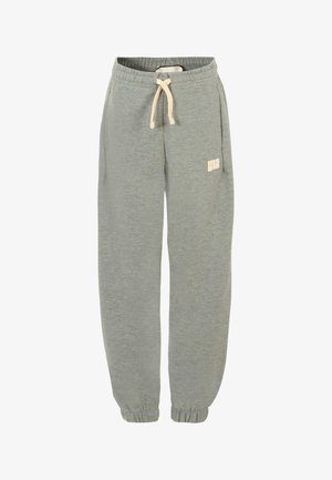 Pantalons de survêtement gris clair en tissu doux, avec une taille élastique, un cordon de serrage et des poignets côtelés. Un petit logo imprimé en beige.