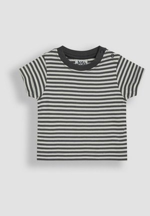 Tricou cu mânecă scurtă, în dungi alb-negru, din bumbac. Are un guler rotund și două butoane cu snaps pe umăr pentru a facilita îmbrăcarea.