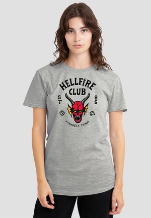 Gray cotton t-shirt featuring a red devil skull graphic with horns and the text "HELLFIRE CLUB" from Stranger Things in black and yellow.