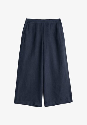 Tumesinised laia jalaga lühikesed püksid küljetaskutega ja sileda elastse vööümbrisega.