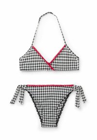 Bikini en vichy noir et blanc avec des culottes à nouer sur les côtés, un bord festonné rouge et un design à cou halter avec des détails croisés sur le devant.