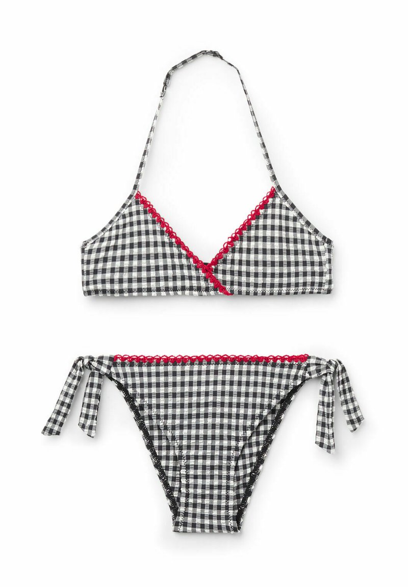 Bikini en vichy noir et blanc avec des culottes à nouer sur les côtés, un bord festonné rouge et un design à cou halter avec des détails crois�és sur le devant.