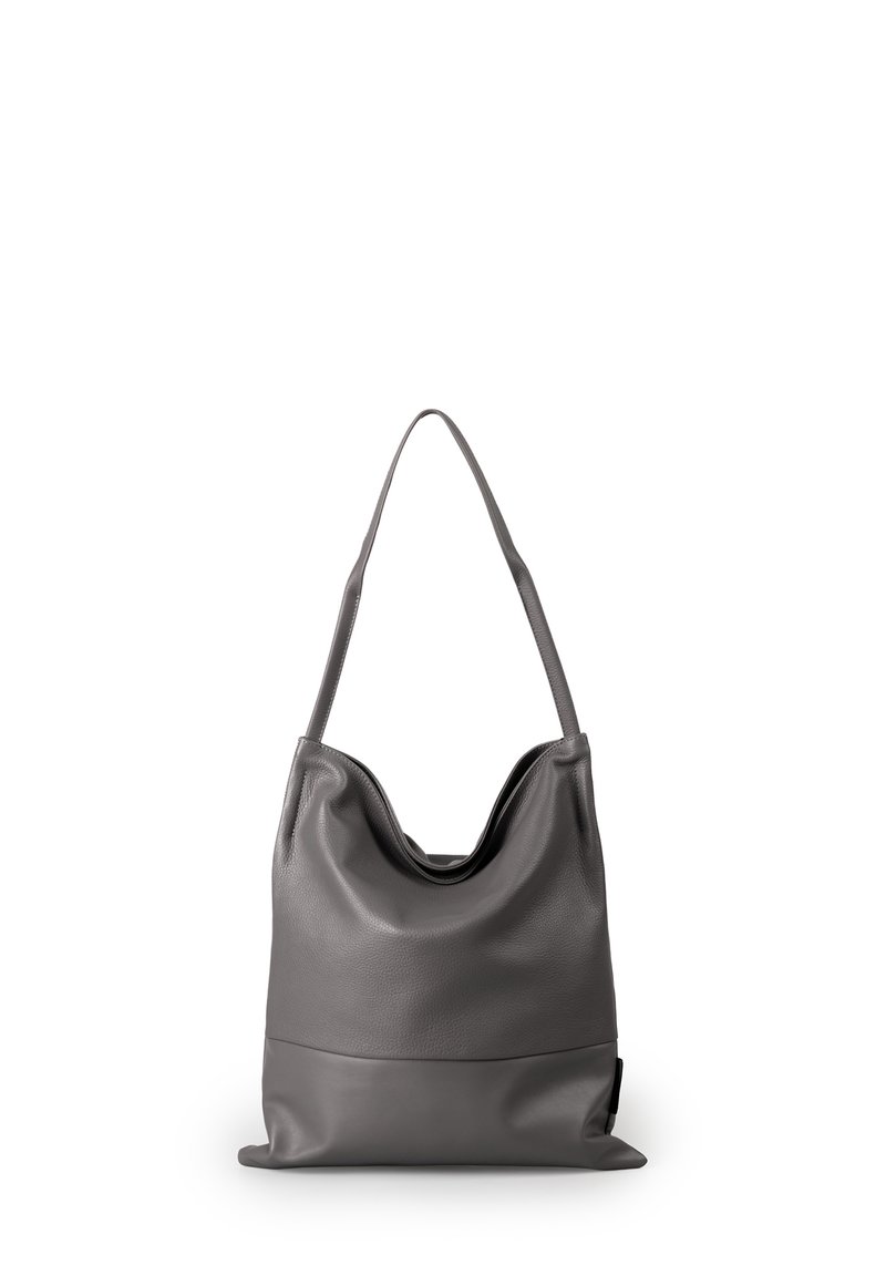Borsa tote in pelle grigia con un design morbido, apertura ampia e una base liscia in contrasto. Presenta una singola tracolla rotonda.