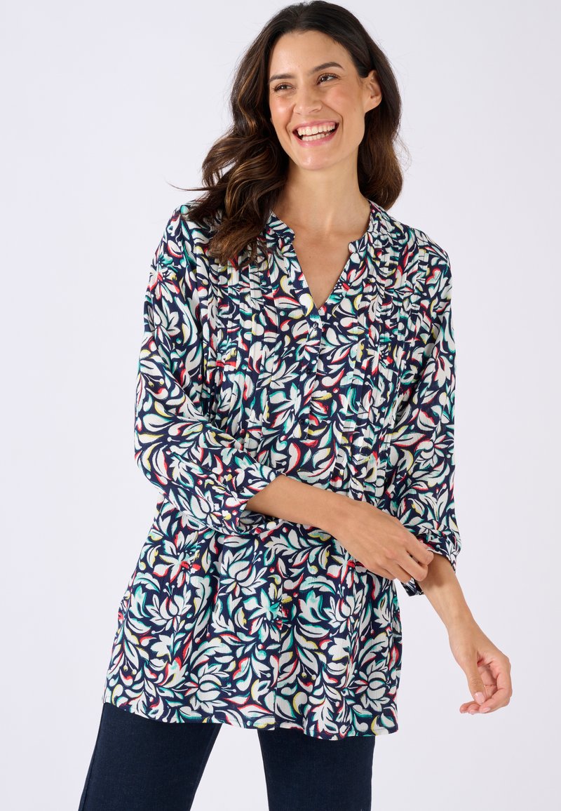 Tunic floreale multicolore in blu notte, con maniche lunghe, scollatura a V e dettagli arricciati, realizzata in tessuto leggero.