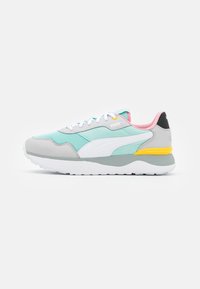 Mint green, gray, white, and pink Puma sneaker with yellow accent, white laces, and cushioned sole, shown in a side profile on white background.