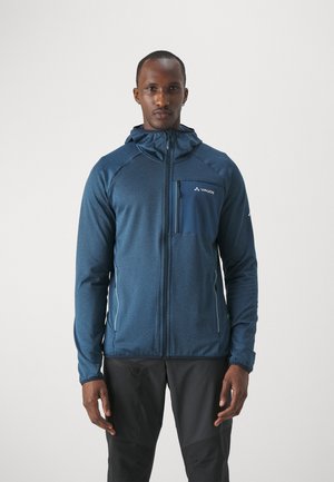 Giacca da uomo blu navy realizzata in tessuto strutturato, con chiusura a zip frontale, cappuccio e tasca sul petto con dettagli del logo.