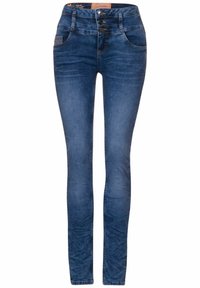 Smala jeans i mörkblå denim med hög midja, med knappstängning, fem fickor och diskreta slitningar på låren.