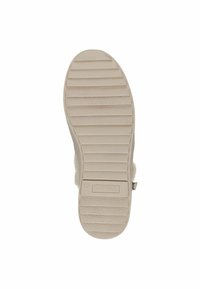 Light beige textured shoe sole with vertical and horizontal grooves, featuring a small logo embossed at the heel.