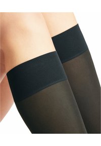 Schwarze Strumpfhosen bis zum Oberschenkel mit einem matten, durchsichtigen Finish, geripptem oberen Rand und glatter Textur, elegant gestaltet für Komfort und Passform.