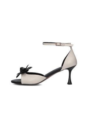 Sandalen - napa tib napa neg glas neg