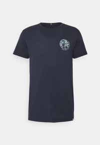 Navy blue cotton t-shirt with short sleeves, featuring a circular graphic design on the chest and a contrasting tag in the neckline.
