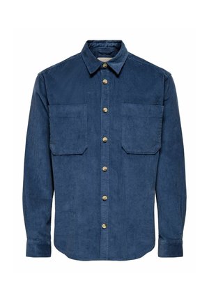 Camicia di velluto a coste blu navy con abbottonatura frontale, due tasche sul petto e colletto classico. Presenta un tessuto testurizzato e bottoni in tono oro.