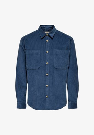 Granatowa koszula z korduroju z zapięciem na guziki z przodu, dwoma kieszeniami na piersi oraz klasycznym kołnierzykiem. Posiada teksturowany materiał i guziki w złotym odcieniu.