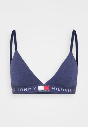 Marinblå triangulär bralette gjord av mjukt tyg, med en logoband som har röda, vita och blå accenter samt justerbara axelremmar.