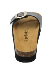 Black leather sandal with a cork footbed, featuring a single adjustable strap and a silver metal buckle. Flat sole, minimalistic design.