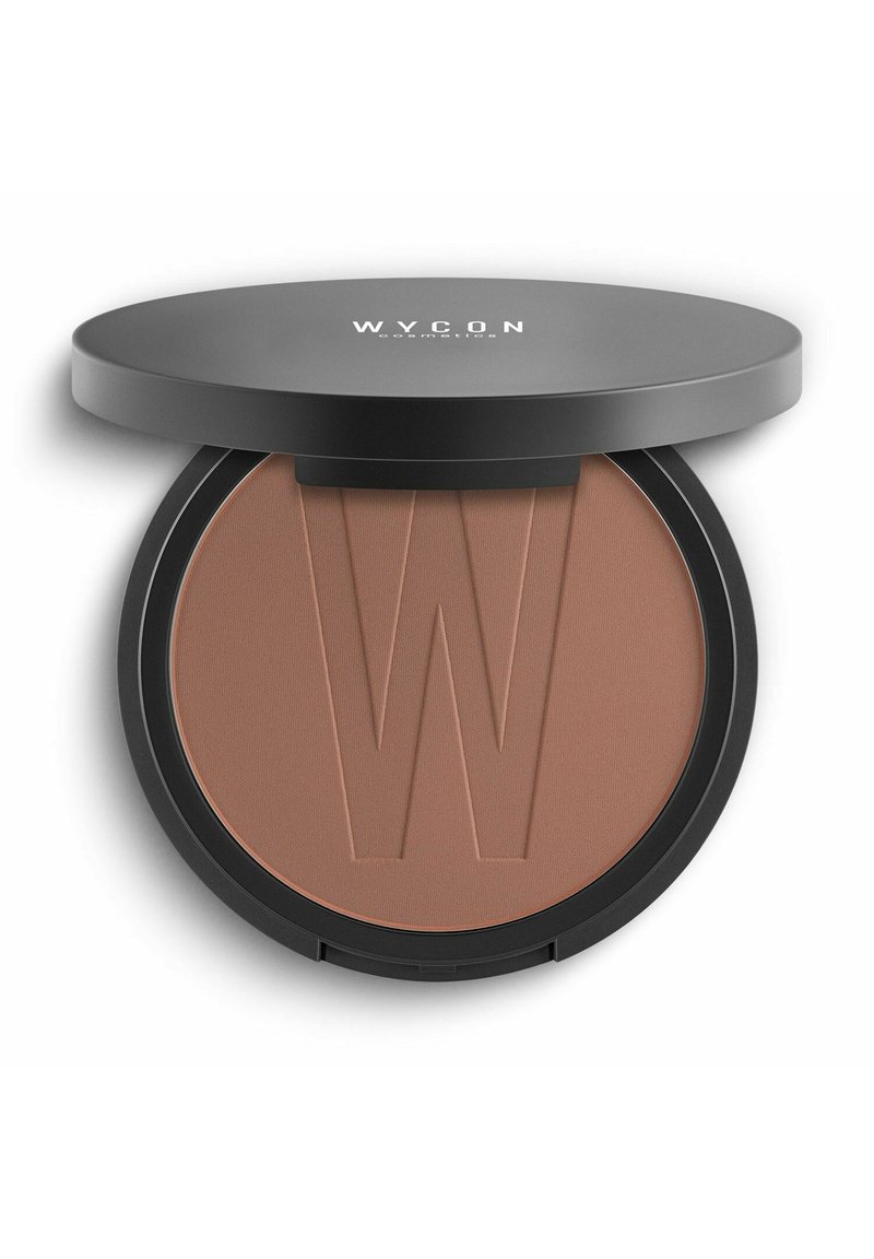 Bronzer W.Y.C.O.N. con finitura in polvere opaca marrone chiaro, contenuto in un compatto rotondo nero con una "W" in rilievo sulla superficie.