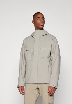 Light gray waterproof jacket with a high collar, front pockets, and snap button cuffs. Smooth texture with subtle logo detail on the chest.