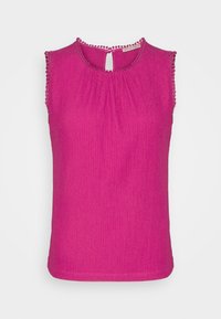 Fuchsia sleeveless top in textured fabric, featuring a round neckline with a keyhole back and a decorative trim along the armholes.
