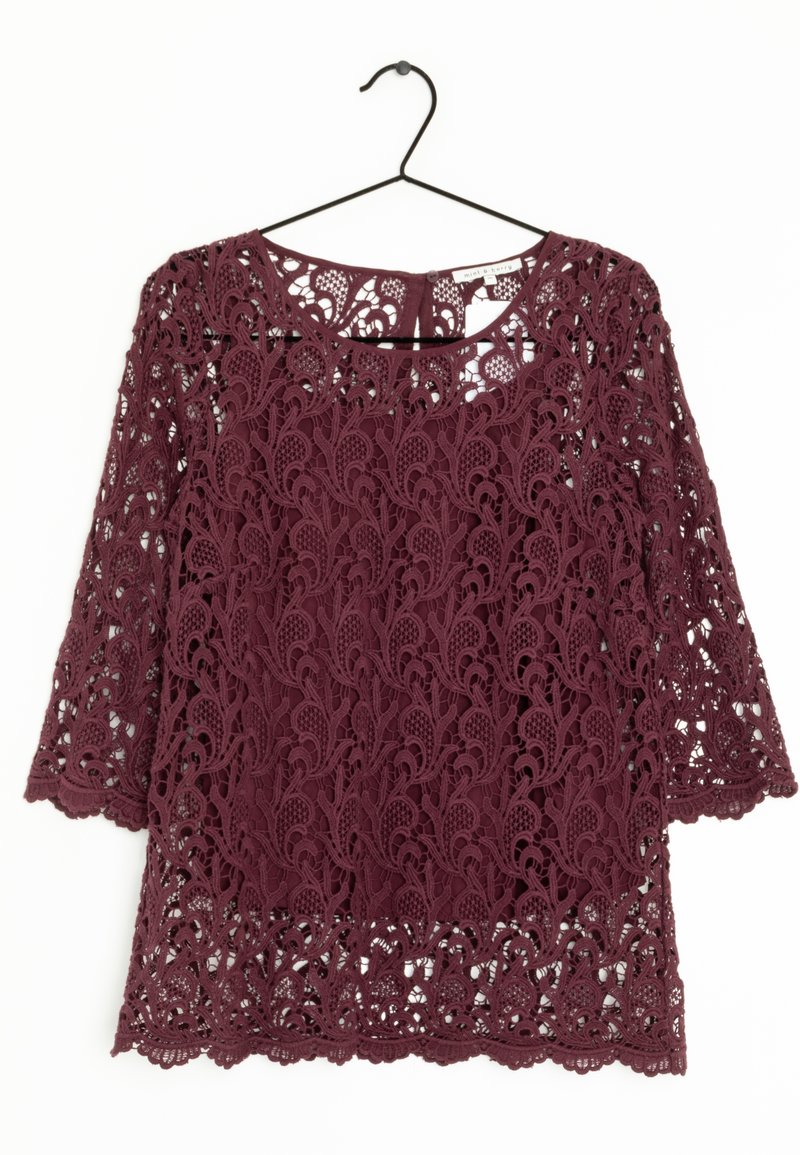 Burgundy lace top featuring floral patterns, three-quarter sleeves, and a round neckline, displayed on a black hanger against a white background.