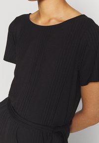 Object Trikoomekko - black