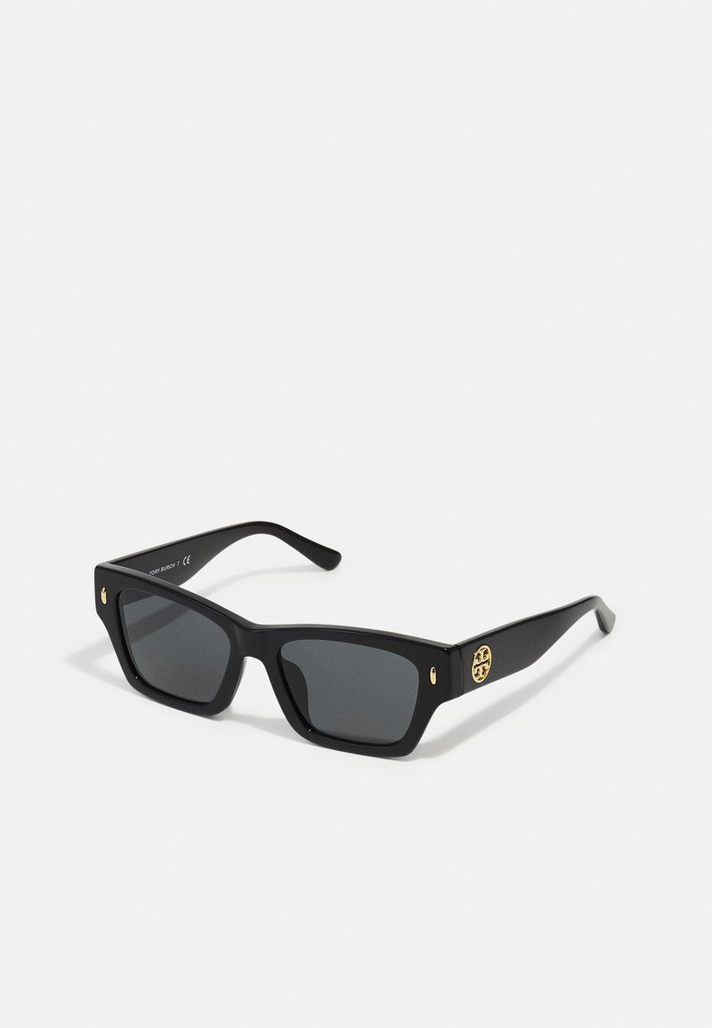 Black sunglasses with a matte finish, rectangular frames, dark lenses, and gold accent logo on the side.