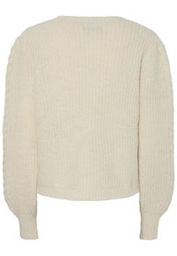 Πλούσια κρεμ μπλούζα με πλέξη, με στρογγυλή λαιμόκοψη, φαρδιά μανίκια και  ribbed cuffs. Υφή σε όλο το ύφασμα.