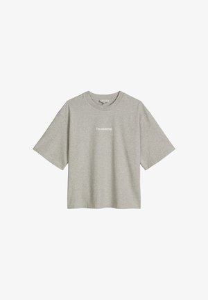 T-shirt gris à manches courtes et col rond avec texte blanc « Je suis essentiel. » centré sur la poitrine, fond uni.