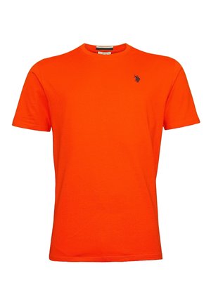 Orange bomull t-shirt med rund halsringning och korta ärmar. Har en liten marinblå logotyp på vänster bröstområde. Slät textur.