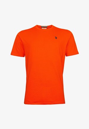 Oranssi puuvillapaita, jossa on pyöreä kaula-aukko ja lyhyet hihat. Vasemmassa rintapielessä pieni tummansininen logo. Sileä pinta.